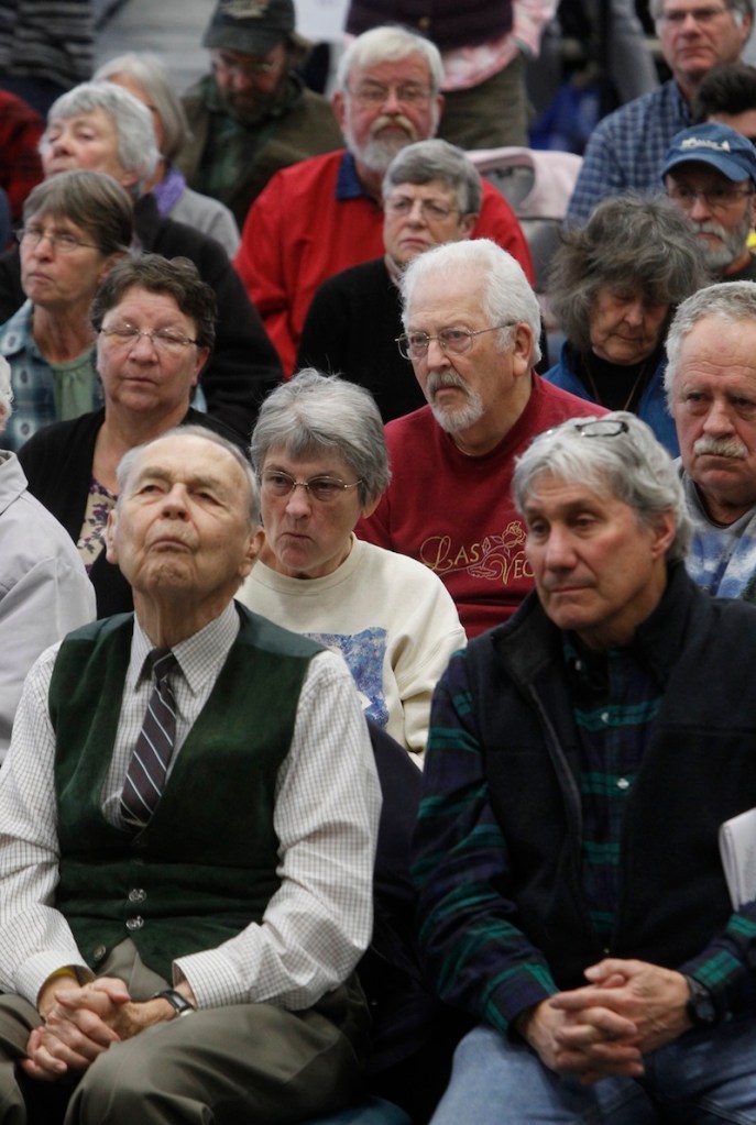 Citizens listen to debate at town meeting on Tuesday, March 5, 2013 in Craftsbury, Vt. Vermonters are heading to their town halls and school gymnasiums for Town Meeting to vote on town and school budget. (AP Photo/Toby Talbot)