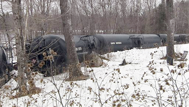 This photo provided by WABI-TV5 in Bangor shows derailed tank cars on Thursday in Mattawamkeag. Fifteen cars of a 96-car train carrying crude oil went off the tracks approximately 60 miles north of Bangor.
