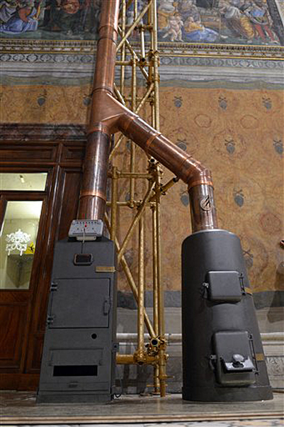 This photo provided by the Vatican newspaper L'Osservatore Romano on Friday shows the stoves inside the Sistine Chapel at the Vatican where the ballots will be burned during the conclave.