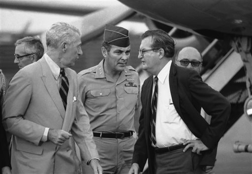 In this April 10, 1973, photo, Gen. Alexander M. Haig, center, is greeted by acting ambassador Charles Whitehouse, left, and another embassy official following Haig's arrival, in Saigon. The trip was made at the behest of President Nixon.
