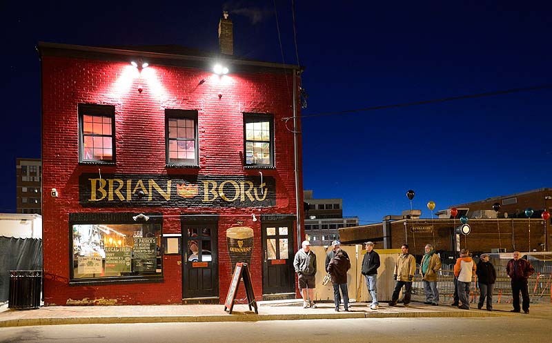 Early revelers wait in line shortly before 6 a.m. for Brian Boru to open for its St. Patrick’s Day celebration Sunday.