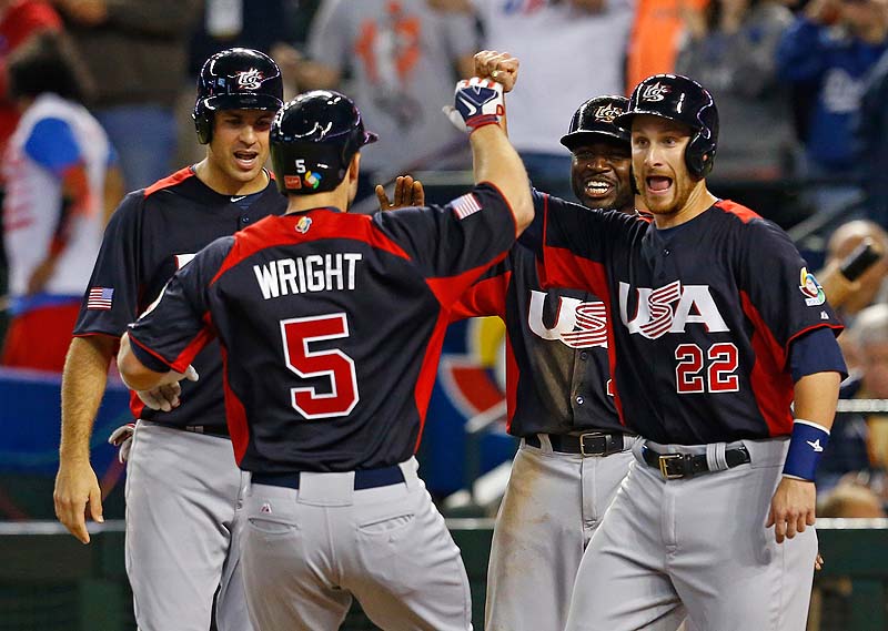 David Wright is greeted after hitting a grand slam in the fifth inning of a World Baseball Classic game against Italy Saturday. The U.S. won, 6-2.