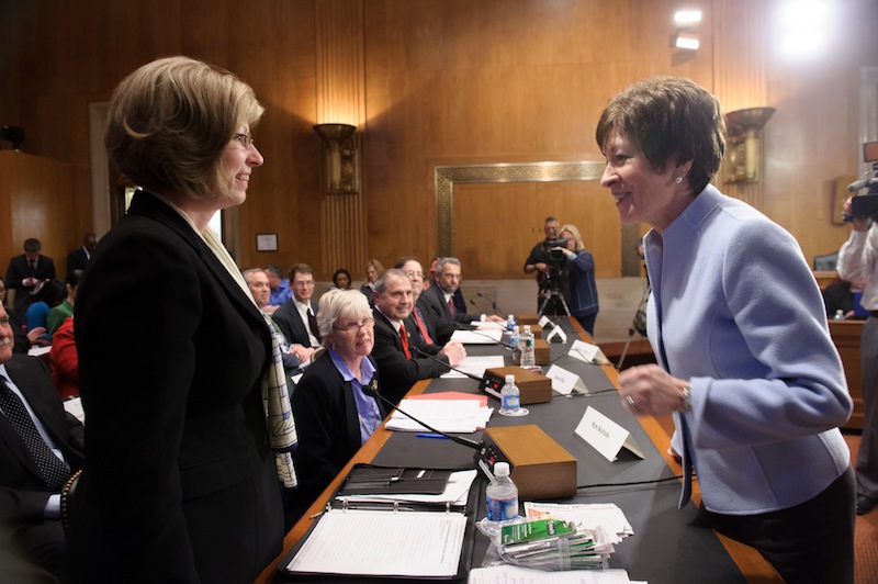 Sen. Susan Collins, R-Maine, talks with Hermon resident Kim Nichols, left, on Thursday before a hearing of the Senate Special Committee on Aging about lottery scams targeting senior citizens. Nichols’ father, who lives in New Hampshire, lost $85,000 to the Jamaica-based scammers.