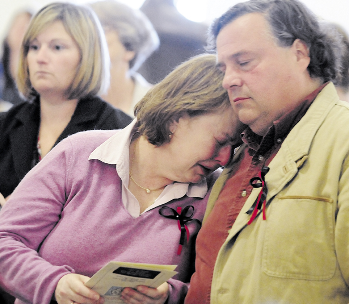 Donna Mills and her husband, Tim Mills, comfort each other during a poem reading in September 2010, at the State of Maine 3rd Annual Day of Remembrance For Murder Victims ceremony held in the State House Hall of Flags in Augusta. Tim Mills on Monday, March 4, 2013 testified in favor of LD 573, which would prevent murderers and class A felons from voting while incarcerated.