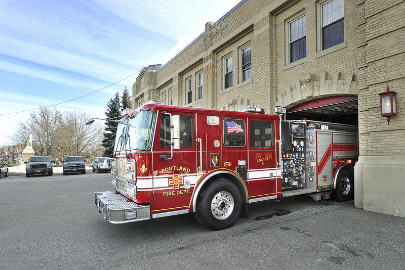 Engine 5 rolls out on a call Friday from the Central Fire Station on Congress Street in February. Portland employs 234 firefighters in seven stations, not including the fireboat quarters and air rescue unit.