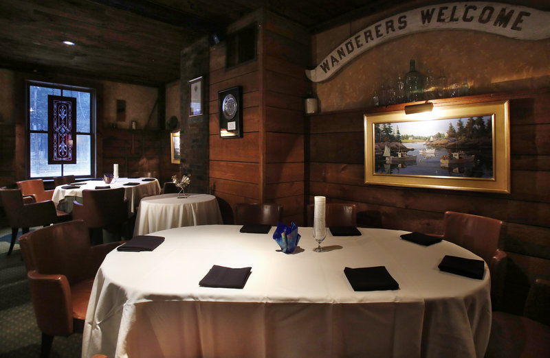 The casual dining area adjacent to the main dining room is the setting for winter bistro meals, including an unforgettable $25 hamburger, at the White Barn Inn in Kennebunk.