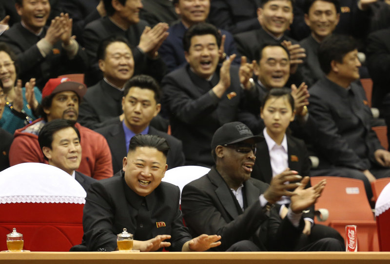 BFFs? North Korean leader Kim Jong Un, left, and former NBA star Dennis Rodman watch North Korean and U.S. players in an exhibition basketball game Thursday.