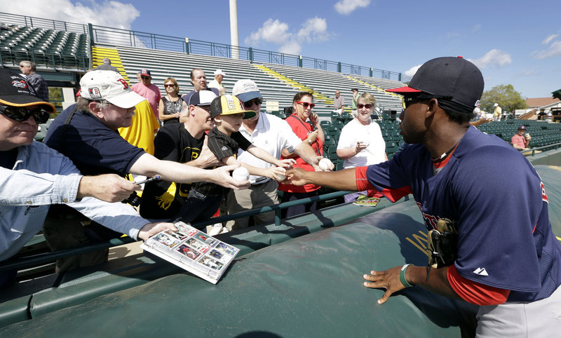 Jackie Bradley Jr., who played for the Sea Dogs last season and is with the Red Sox in spring training, signs autographs Thursday before the game against the Pittsburgh Pirates.