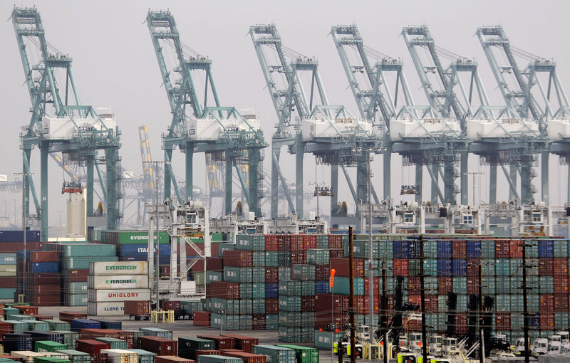 Shipping containers are seen as operations halt during a strike at the Port of Los Angeles on Dec. 4. The U.S. economy grew at a 0.1 percent annual rate in the fourth quarter.