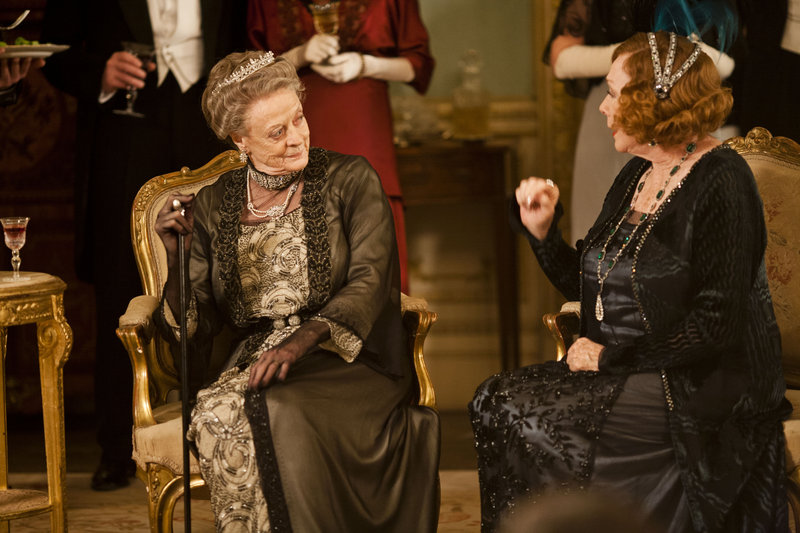 Maggie Smith as Lady Violet Crawley, the dowager countess of Grantham, left, from "Downton Abbey." A self-confessed addict wonders if Americans' love for the series is due partly to the characters' "delicacy of speech."