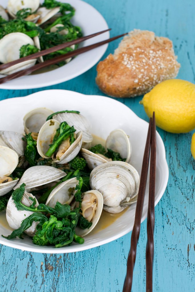 Asian steamed clams or mussels with broccoli rabe. The first step is to blanch the broccoli rabe, which blunts the vegetable’s slightly bitter edge.