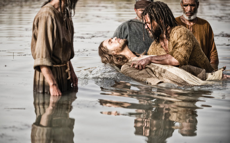 Jesus, portrayed by Diogo Morgado, is baptized by John, played by Daniel Percival, in “The Bible,” a miniseries that debuts Sunday evening on History. The cable production “is an epic tale of adventure,” said Nancy Dubuc, president of the channel.