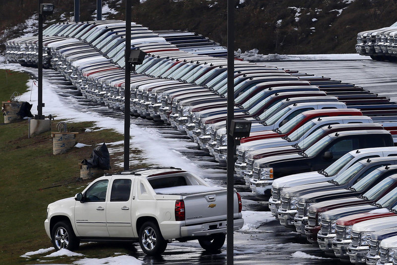 Chevy trucks line the lot of a dealer in Murrysville, Pa. General Motors said sales of its pickups to small businesses in February were up 40 percent from a year ago, partly because of growth in home building.