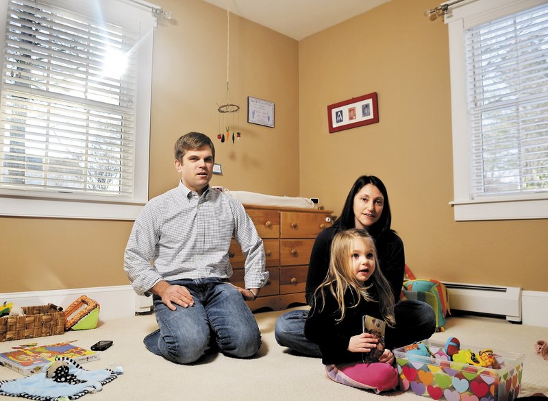 Ethan and Emily Bessey, with their daughter, Daisy, discuss the brief life of their son, Ezra, in the boy’s bedroom at their Hallowell home. Emily’s online journal was read by thousands.