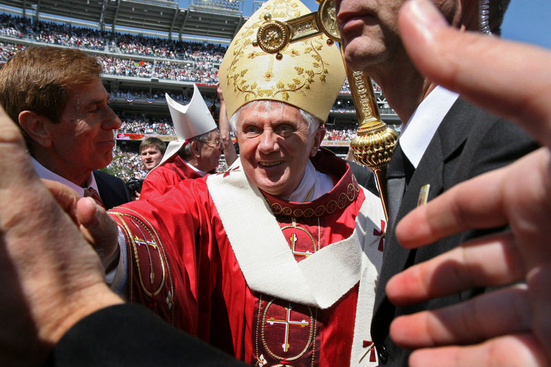 Pope Benedict XVI greets the faithful after celebrating Mass at Nationals Park in Washington in 2008. The pope announced on Feb. 11 that he would step down as head of the Catholic Church. The conclave, or voting meeting, is expected this month.