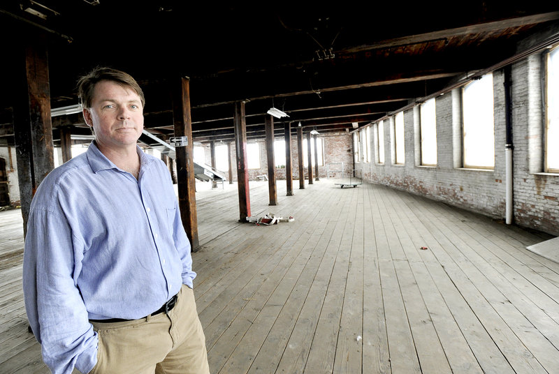 Scott Joslin, COO of the Pepperell Mill Campus, stands inside the site of a proposed hotel and restaurant Monday, March 4, 2013 to be located at the old Biddeford mill complex.