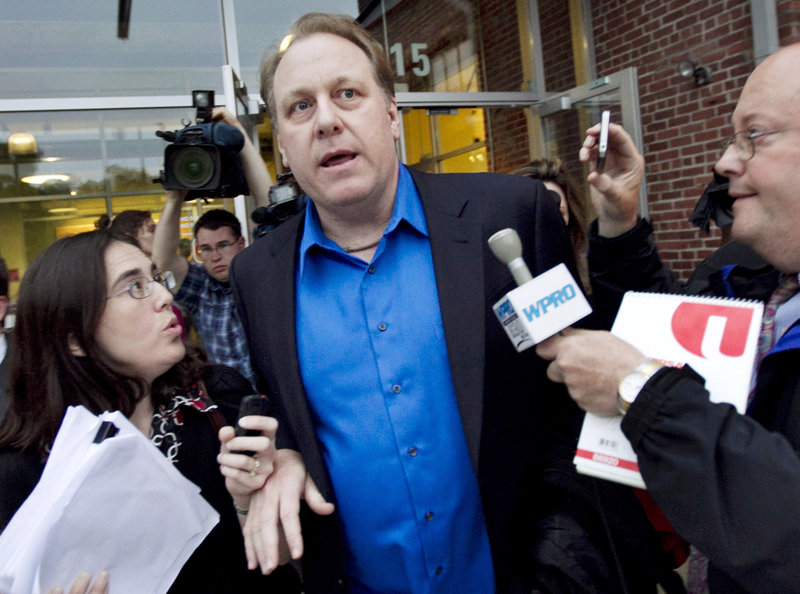 In this May 21, 2012 file photo, former Boston Red Sox pitcher Curt Schilling, center, departs the Rhode Island Economic Development Corporation headquarters in Providence, R.I. Attorneys representing Schilling and others at his former startup, 38 Studios, on Friday, March 1, 2013, filed documents asking Superior Court Judge Michael Silverstein to dismiss a state economic development agency lawsuit over its $75 million loan guarantee for his now-defunct video game company. (AP Photo/Steven Senne, File)