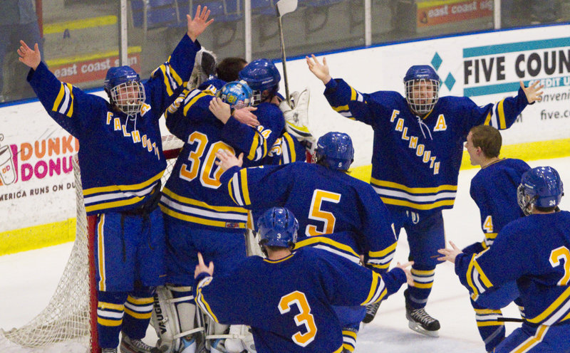 Falmouth celebrates after beating Scarborough 4-3 for the Class A Western Maine finals in Lewiston on Tuesday.