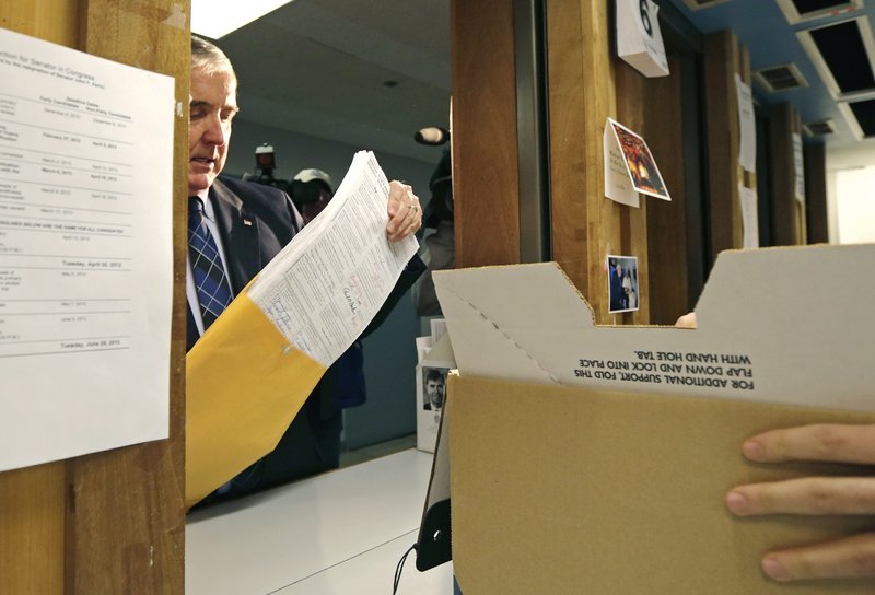 Republican U.S. Senate candidate Michael Sullivan drops off signatures at the secretary of state's office, allowing him a spot on the primary ballot for the special election to fill the seat formerly held by John Kerry, in Boston, Wednesday, March 6, 2013. (AP Photo/Charles Krupa)