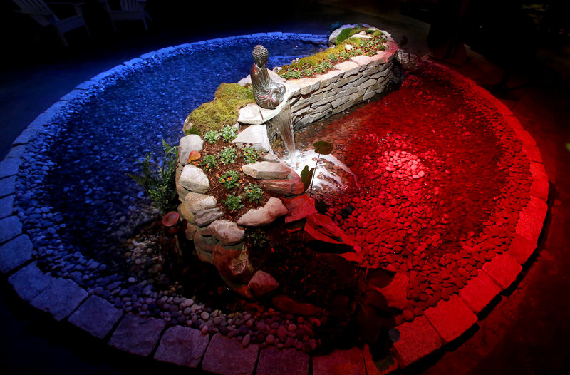 A yin-yang water garden created by Robins Nest Aquatics is one of the many displays for visitors during the opening night of the "Timeless Gardens" Portland Flower Show at the Portland Company Complex in Portland on March 6, 2013.