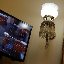 U.S. Senator Rand Paul appears on a television screen in an office at the U.S. Capitol as he filibusters on the Senate floor in Washington