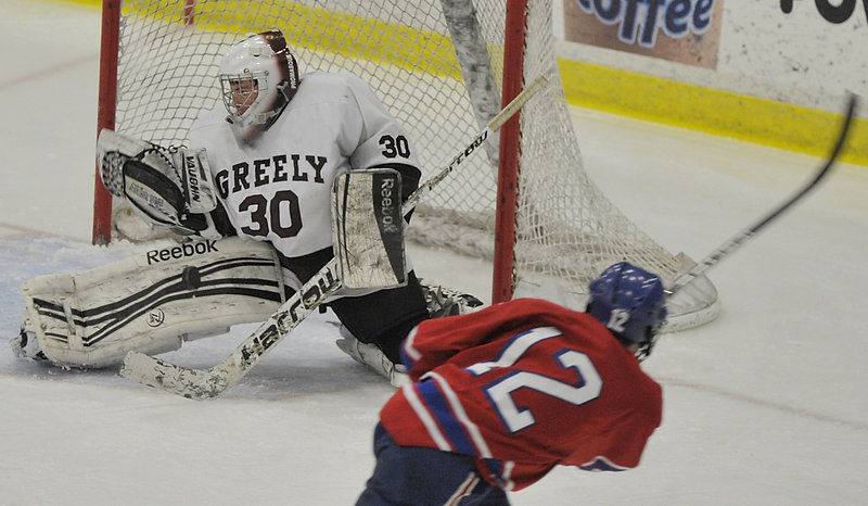 Greely goalie Kyle Kramlich makes one of his 18 saves on the way to a shutout against a Messalonskee team that was averaging six goals per game.