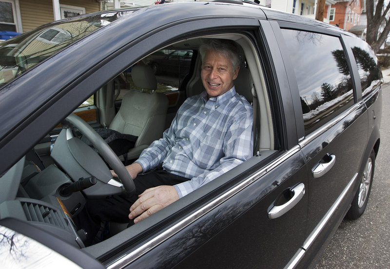 Jim Casso, 60, sits in the black van that he uses for his job, in front of his Meriden, Conn., home. Casso’s job is picking up the deceased whose bodies are being donated to science for Quinnipiac University’s medical school.