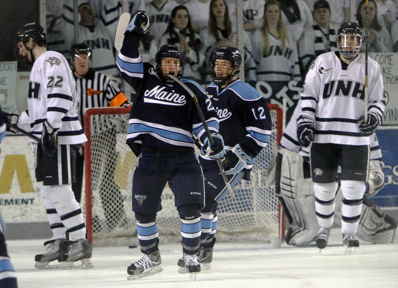 Adam Shemansky celebrates his goal in the second period Saturday that helped Maine earn a 4-4 tie at New Hampshire in its regular-season finale.