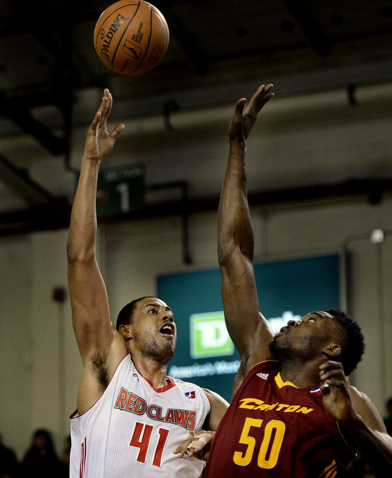 Red Claws center Fab Melo puts up a shot over Michael Eric of the Canton Charge during Sunday’s D-League game at the Expo. Canton won, 108-83.