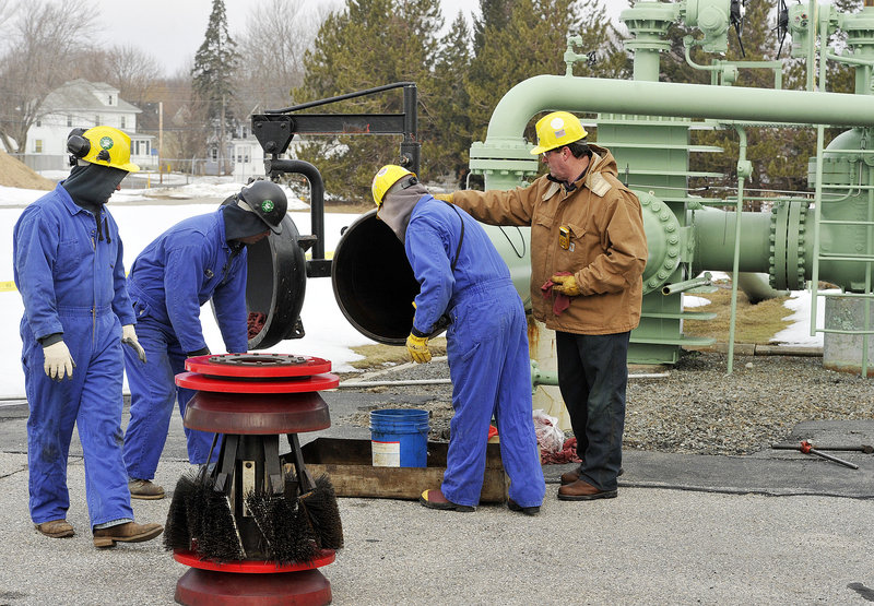 Pipeline workers prepare the scraper-launching trap in mid-March before their brush “pig” device was to begin its two-and-a-half-day trip to Montreal to clean the 24-inch-diameter pipe.