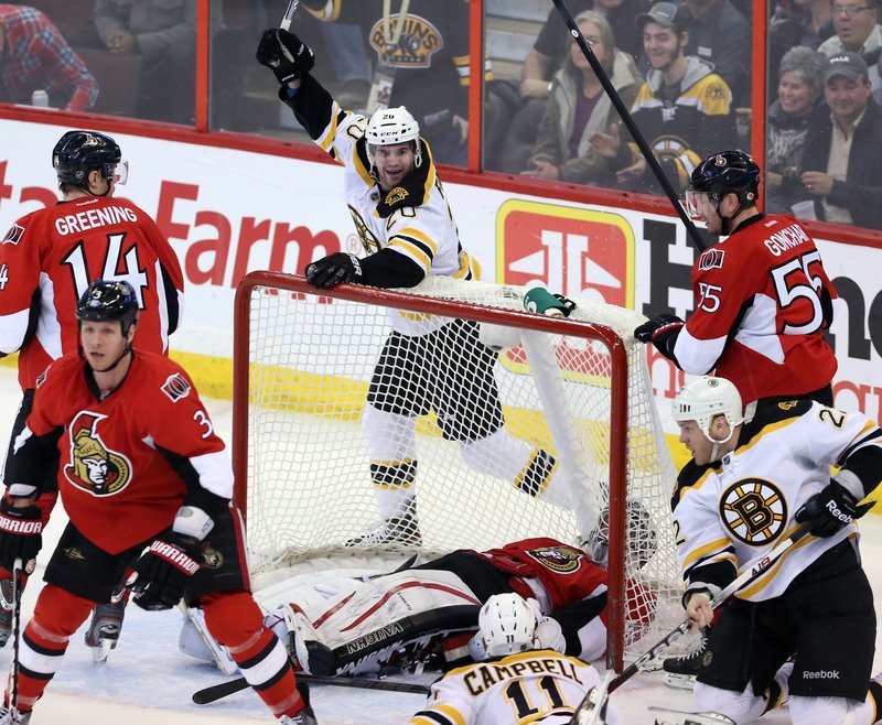 Boston's Daniel Paille celebrates a goal during the first period of the Bruins’ game against the Ottawa Senators on Monday in Ottawa, The Bruins won in a shootout, 3-2.