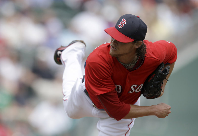 Clay Buchholz pitches on his way to a win against the Toronto Blue Jays Tuesday. "Better tempo once again, consistent with his last outing," Red Sox Manager John Farrell said.