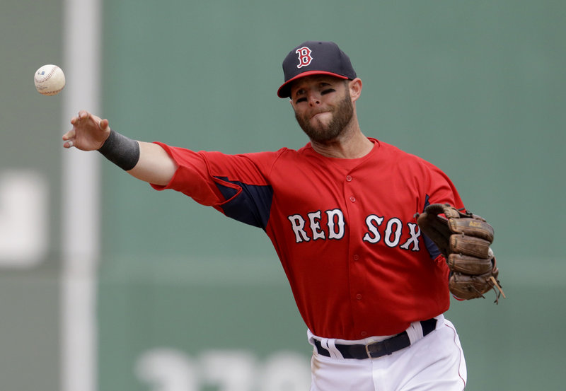 Dustin Pedroia of the Red Sox makes a throw from second in Tuesday’s game against Toronto at Fort Myers, Fla.