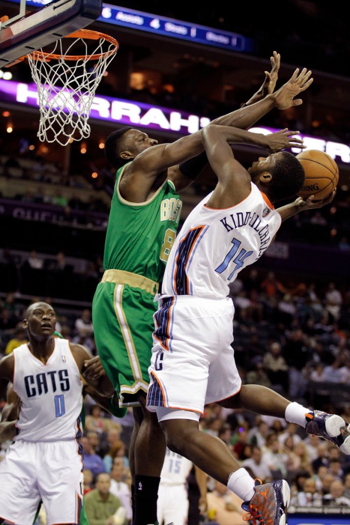 Boston’s Jeff Green puts strong defensive pressure on Charlotte’s Michael Kidd-Gilchrist during the Bobcats’ 100-74 win at Boston on Tuesday night.