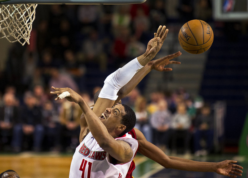 Fab Melo has his attempted slam-dunk knocked away by Fort Wayne’s Brandon Wallace during Thursday’s 105-90 loss at the Expo Center that leaves the Red Claws 1 1⁄2 games out of a playoff berth with just eight games left in the season.