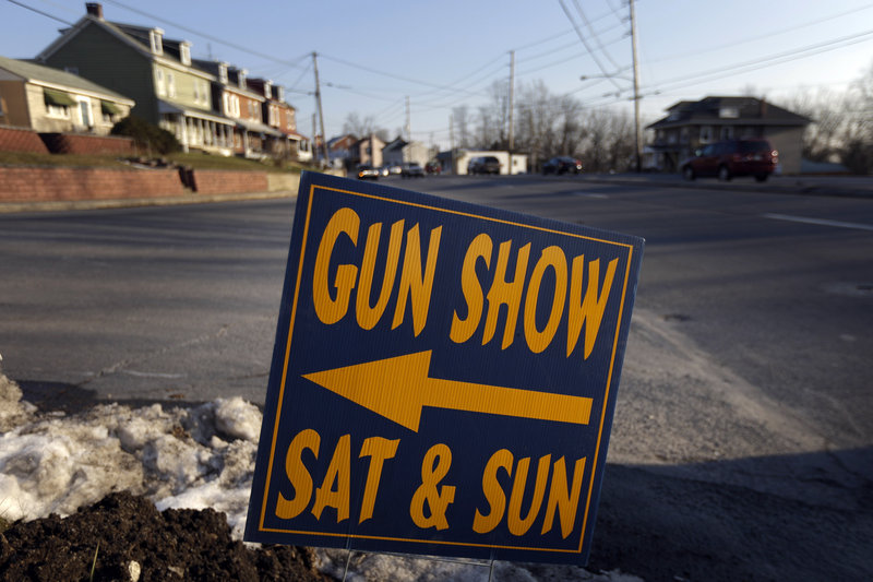 A sign directs visitors to a Leesport, Pa., gun show in a Jan. 4 file photo. A background-check bill will be ineffective if it doesn’t call for private sellers to keep records of sales, says the head of the Maine Chiefs of Police Association.