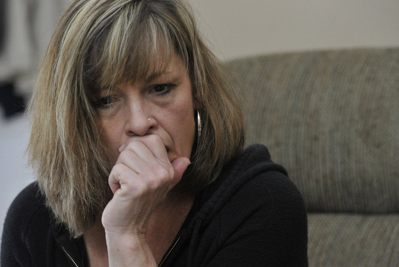Laura Schlosser watches a video last week of the 2012 incident involving her son, inmate Paul Schlosser, and Capt. Shawn Welch at the Maine Correctional Center in Windham. “As a mother, it makes me want to throw up,” she said.