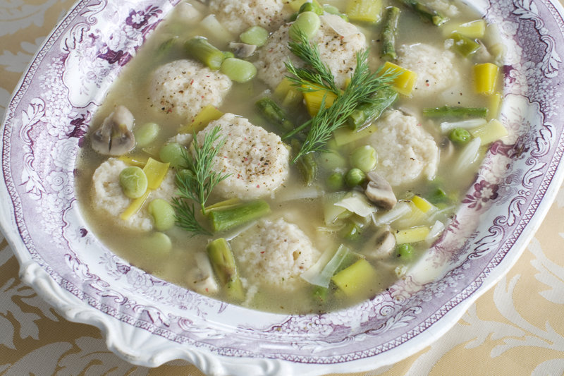 Spring vegetable soup with low-fat, high-flavor matzo balls.