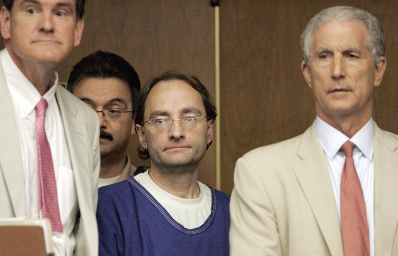 Attorneys Bradford Bailey, left, and Jeffrey Denner, right, stand with Christian Karl Gerhartsreiter in court on July 8, 2011, in Alhambra, Calif. Gerhartsreiter, who masqueraded as a member of the famous Rockefeller family, faces charges that he murdered his landlord more than a quarter-century ago.