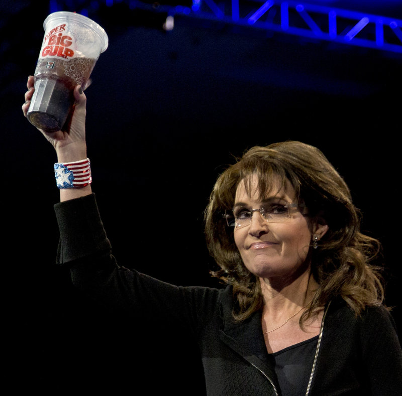 Former Alaska Gov. Sarah Palin mocks the Democrats with a 7-Eleven Super Big Gulp soda on Saturday.