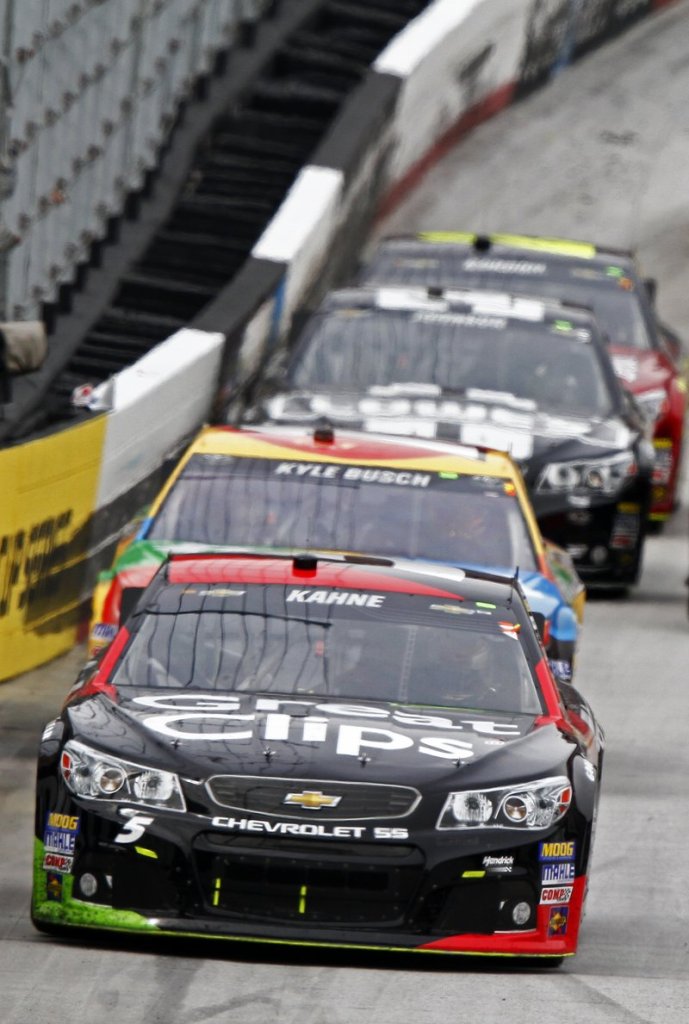 Kasey Kahne’s No. 5 Chevrolet leads Kyle Busch at the Food City 500 at the Bristol Motor Speedway in Bristol, Tenn., on Sunday. Kahne won, Busch finished second.