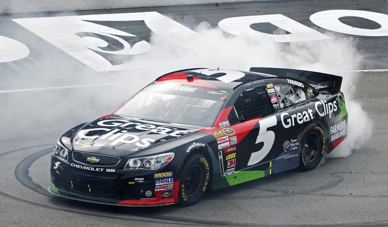Kasey Kahne smokes ‘em after his win over Kyle Busch at the Bristol Motor Speedway on Sunday – the second victory for the Hendrick team this year.