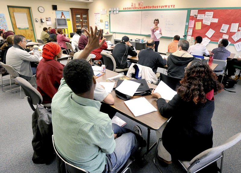 Immigrants attend English classes at West School in Portland in 2012. Accepting federal Medicaid funds would not only allow access to health care but also create jobs, addressing a need in the immigrant community, an advocate says.