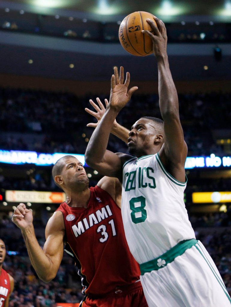Boston’s Jeff Green drives past Miami’s Shane Battier during the Heat’s 105-103 win at Boston on Monday. Green scored a career-high 43 points.