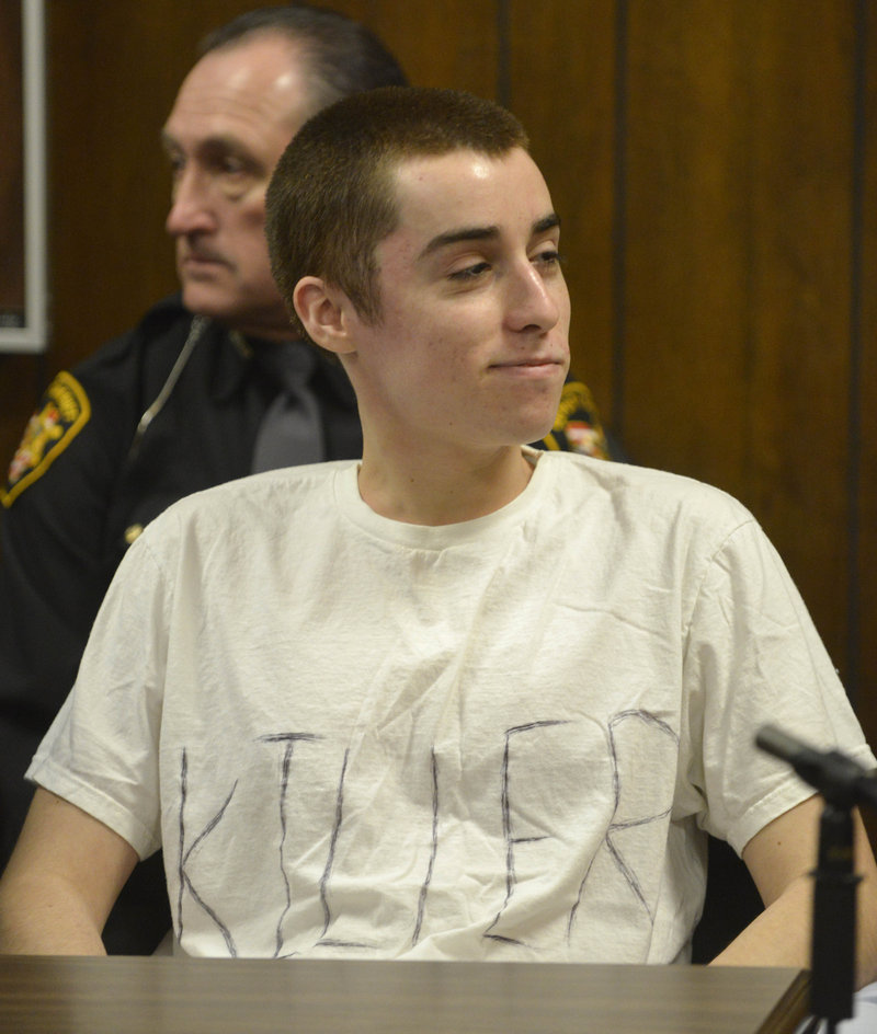 T.J. Lane smirks during his sentencing Tuesday in Chardon, Ohio. He wore a dress shirt into court, then took it off to reveal this T-shirt.