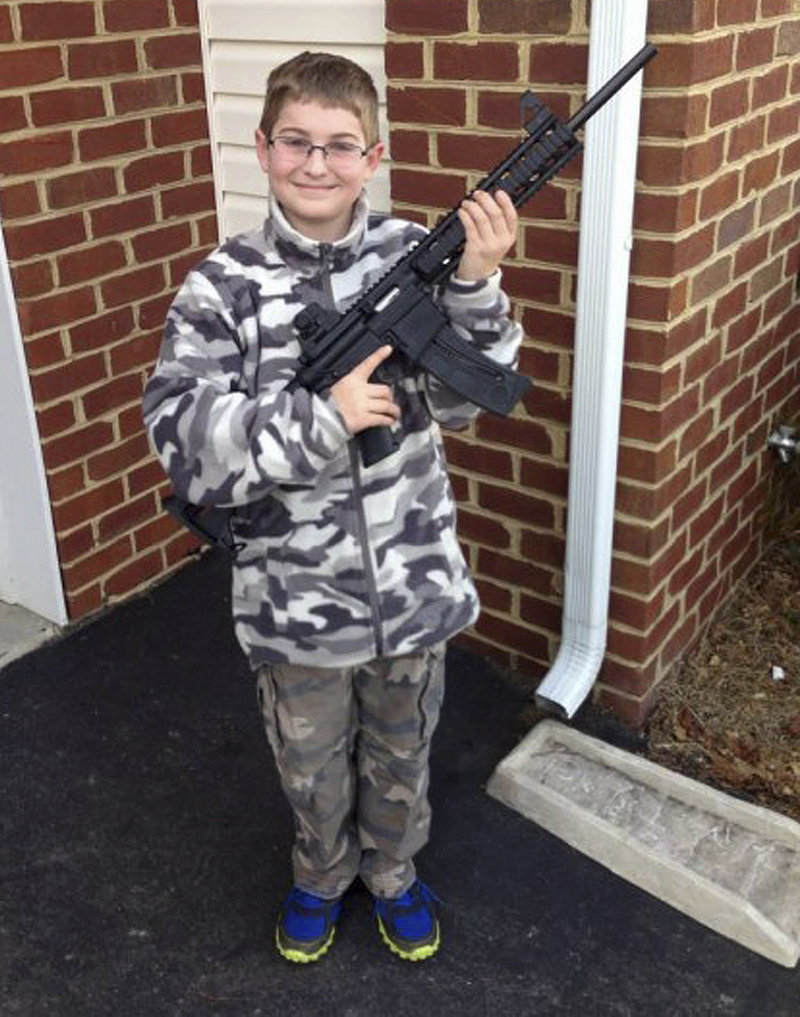 The Moore family claims this photo, posted on Facebook, led the state’s child welfare agency to visit the family’s house, demanding to be let inside to inspect their guns.