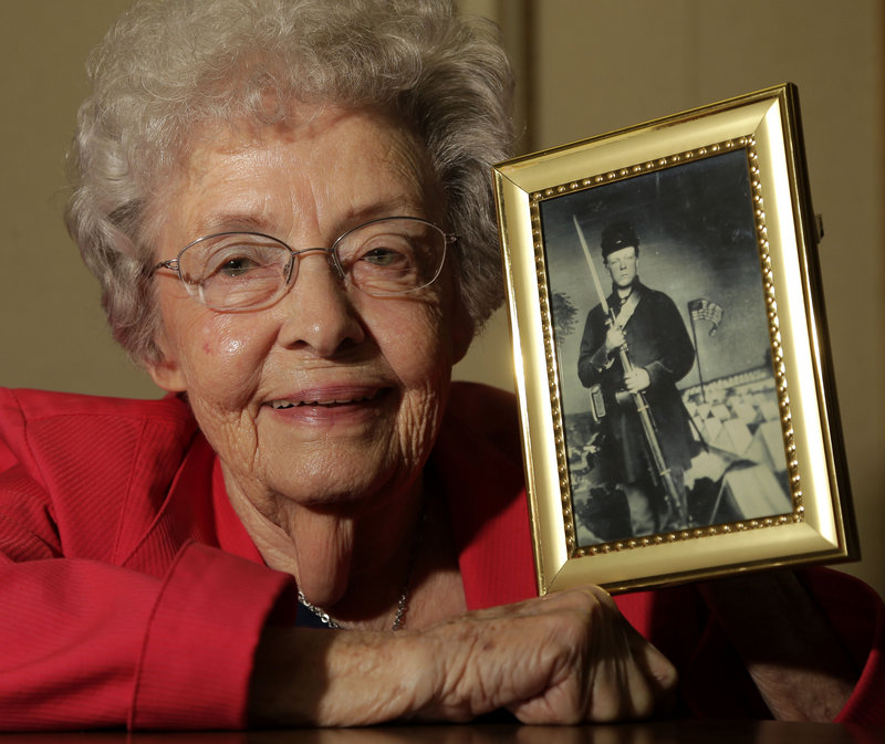 Juanita Tudor Lowrey, 86, holds a photo of her father, Civil War veteran Hugh Tudor. Lowrey received Civil War pension benefits until she was 18.