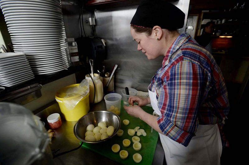 Skye Bonney works away at a batch of her high-end deviled eggs in the kitchen at The Black Birch in Kittery.