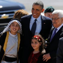 U.S. President Obama and Palestinian President Abbas pose for a photo during a welcoming ceremony in Ramallah