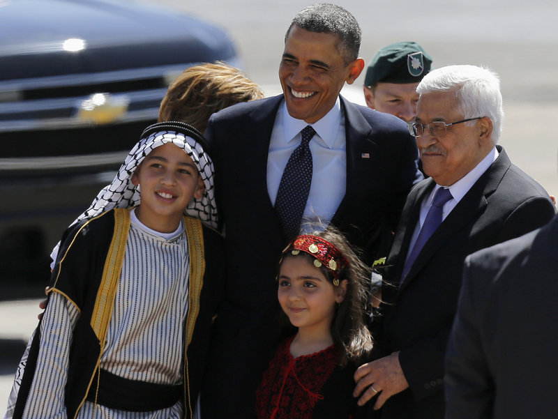 President Obama and Palestinian President Mahmoud Abbas pose with Palestinian children Thursday after Obama traveled to the West Bank for talks with Palestinian leaders. He urged both sides to shed the “formulas and habits that have blocked progress for so long.”